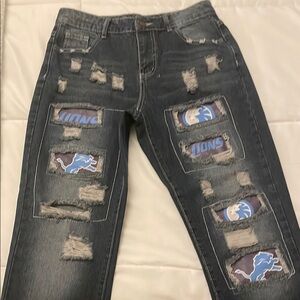 Distressed Denim Jeans with Lions Patches
